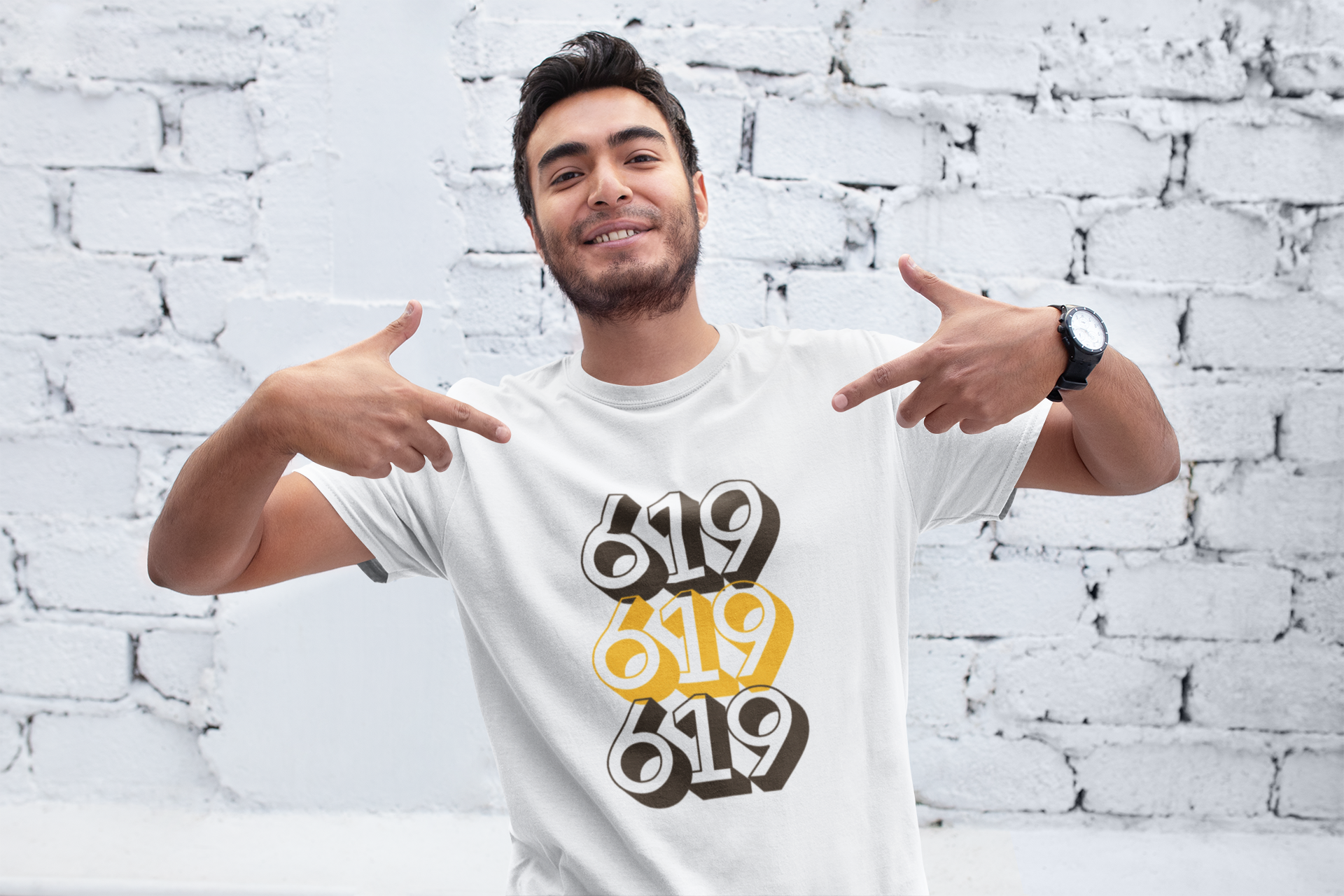 Cool guy pointing at his brown and gold 619 t-shirt.