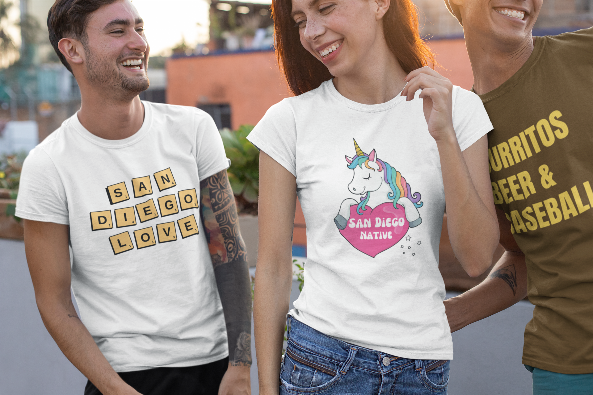 Three friends having fun in the street wearing San Diego t-shirts.