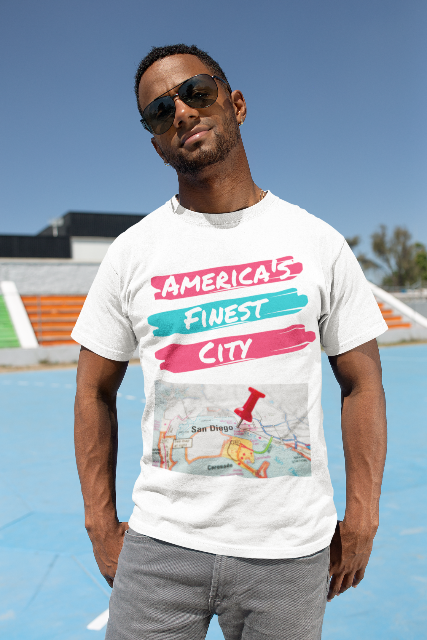 Cool black man with sunglasses standing outside downtown wearing an America's Finest City t-shirt