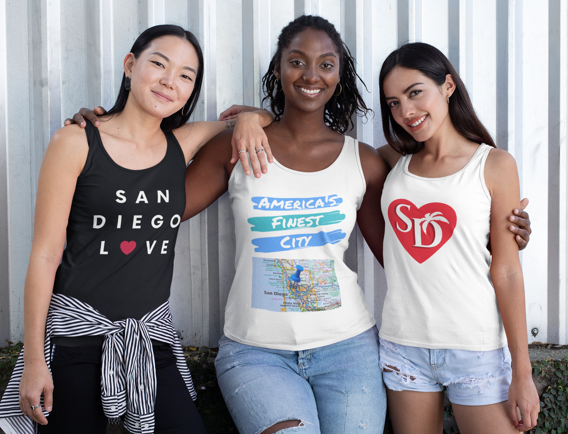 Three smiling girlfriends wearing San Diego summer tanks tops.